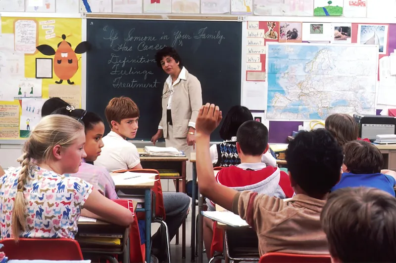 IB-trained tutor helping a student