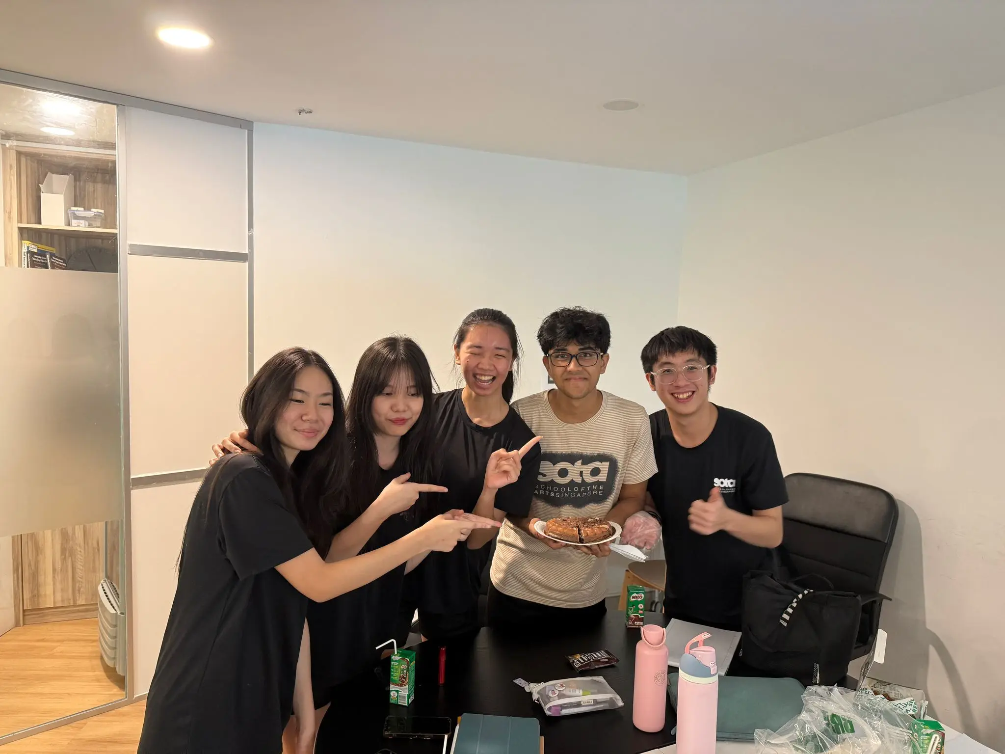 IB students celebrating together at Photon Academy IB tuition centre in Singapore